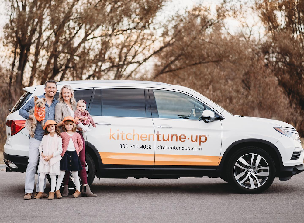 franchise owners family with company vehicle